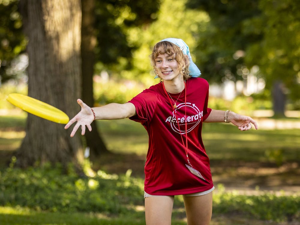 A Ball State student throws a frisbee at the Summer Bridge Accelerate dinner Aug. 16 at Bracken House with President Mearns. Samantha Blankenship, Ball State University, Photo Provided