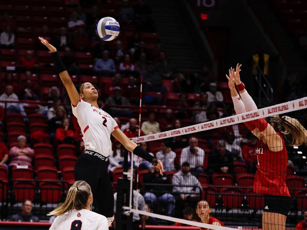 Graduate student middle hitter Aayinde Smith spikes the ball against Miami Nov. 12 at Worthen Arena. Smith had eight blocks against the Redhawks. Andrew Berger, DN