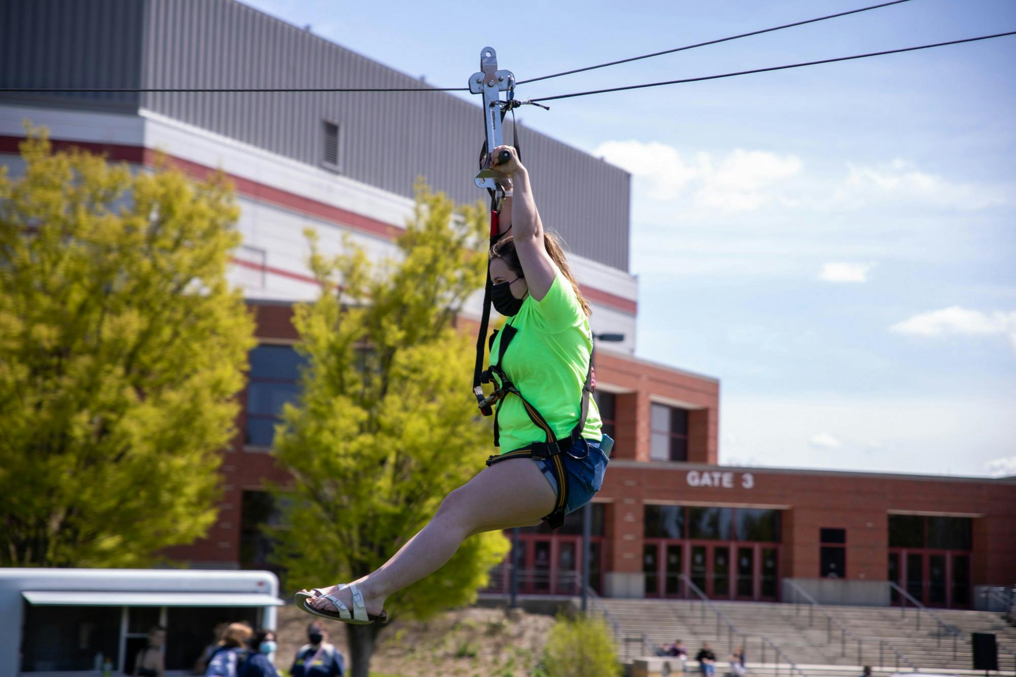 Sophomore psychology major Kara Brown rides down a zipline April 14, 2021, at LaFollette Field. “I’m so nervous,” Brown said. Jaden Whiteman, DN