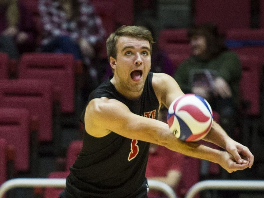 Sophomore outside hitter Blake Reardon, receives a serve from a Harvard player during the beginning of the third set, Jan. 20 at John E. Worthen Area. Grace Hollars, DN File