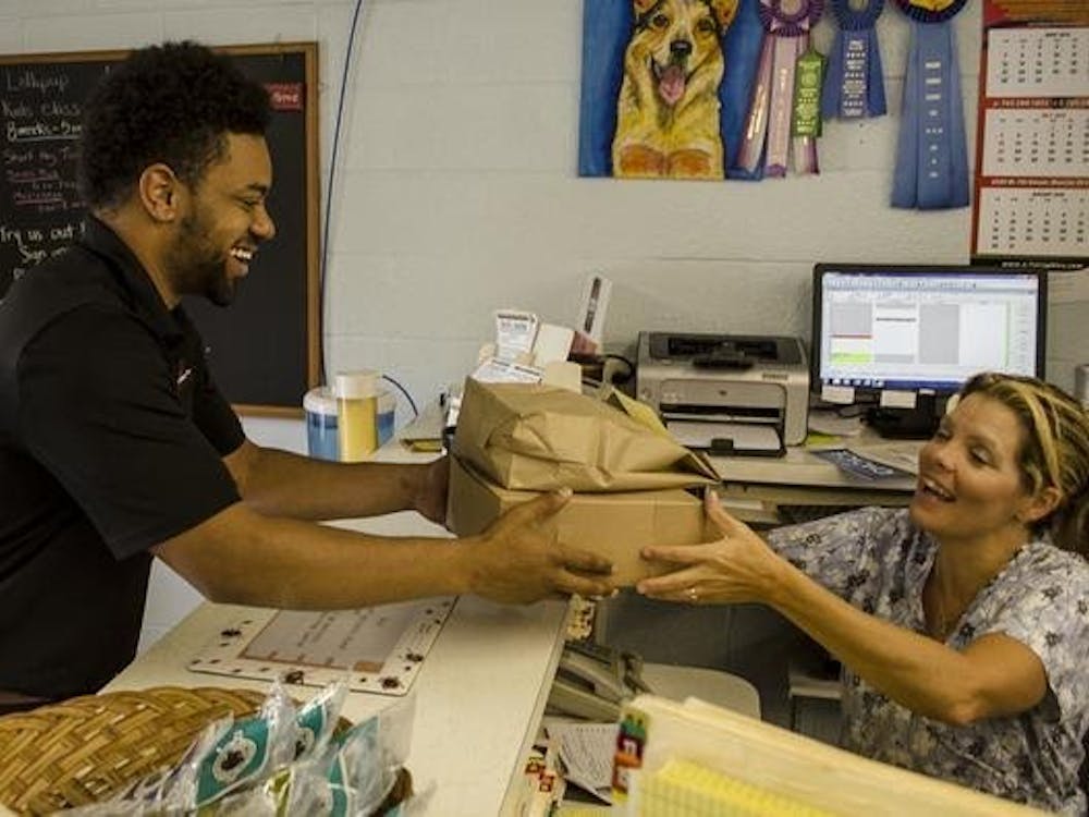 Owner Jordan Presley delivers food to a customer at work. PHOTO PROVIDED BY TRANZIND DELIVERY