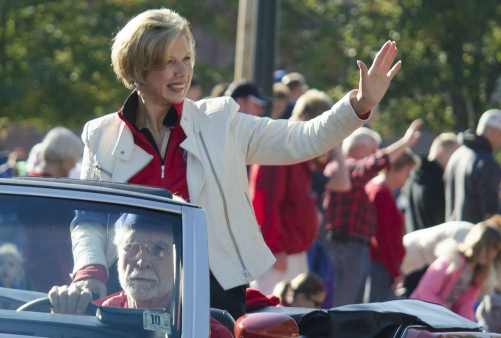 Ball State President Jo Ann Gora waves to the crowd during the Homecoming Parade on Oct. 12. Gora announced in an email she will retire in June, 2014. DN PHOTO BREANNA DAUGHERTY