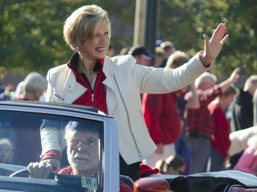 Ball State President Jo Ann Gora waves to the crowd during the Homecoming Parade on Oct. 12. Gora announced in an email she will retire in June, 2014. DN PHOTO BREANNA DAUGHERTY