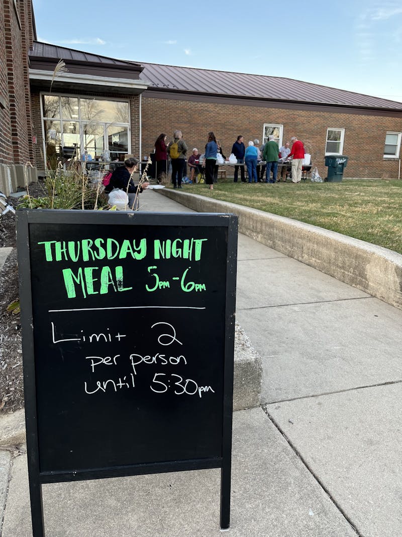 A sign for a Thursday night meal is set up outside of Avondale United Methodist Church in Muncie, Ind., Nov. 10, 2022. The corner of S. Sampson Avenue and W. Tenth Street plays host to this weekly event that provides food for the Muncie community. Kyle Smedley, DN
