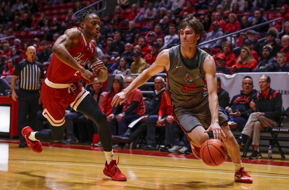 Freshman forward Mason Jones makes a hard drive at the basket Jan. 27 against Northern Illinois at Worthen Arena. Jones had ten points against the Huskies. Andrew Berger, DN