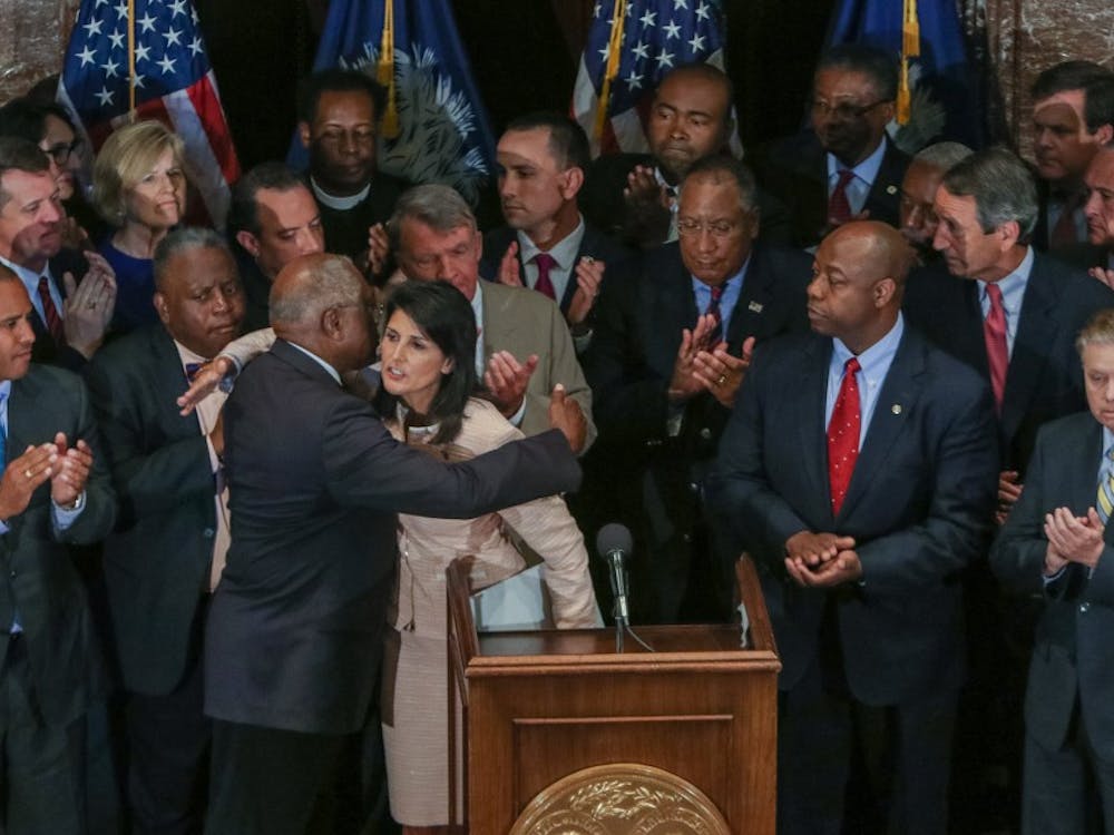 South Carolina Gov. Nikki Haley hugs U.S. Congressman James Clyburn after she called for legislators to remove the Confederate flag from the grounds of the State House during a press conference on Monday, June 22, 2015, in Columbia, S.C. (Tim Dominick/The State/TNS)