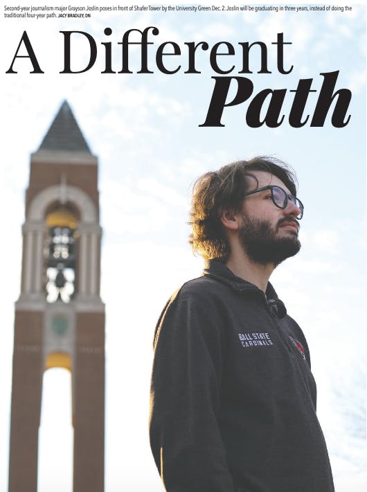 Second-year journalism major Grayson Joslin poses in front of Shafer Tower by the University Green Dec. 2. Joslin will be graduating in three years, instead of doing the traditional four-year path. Jacy Bradley, DN