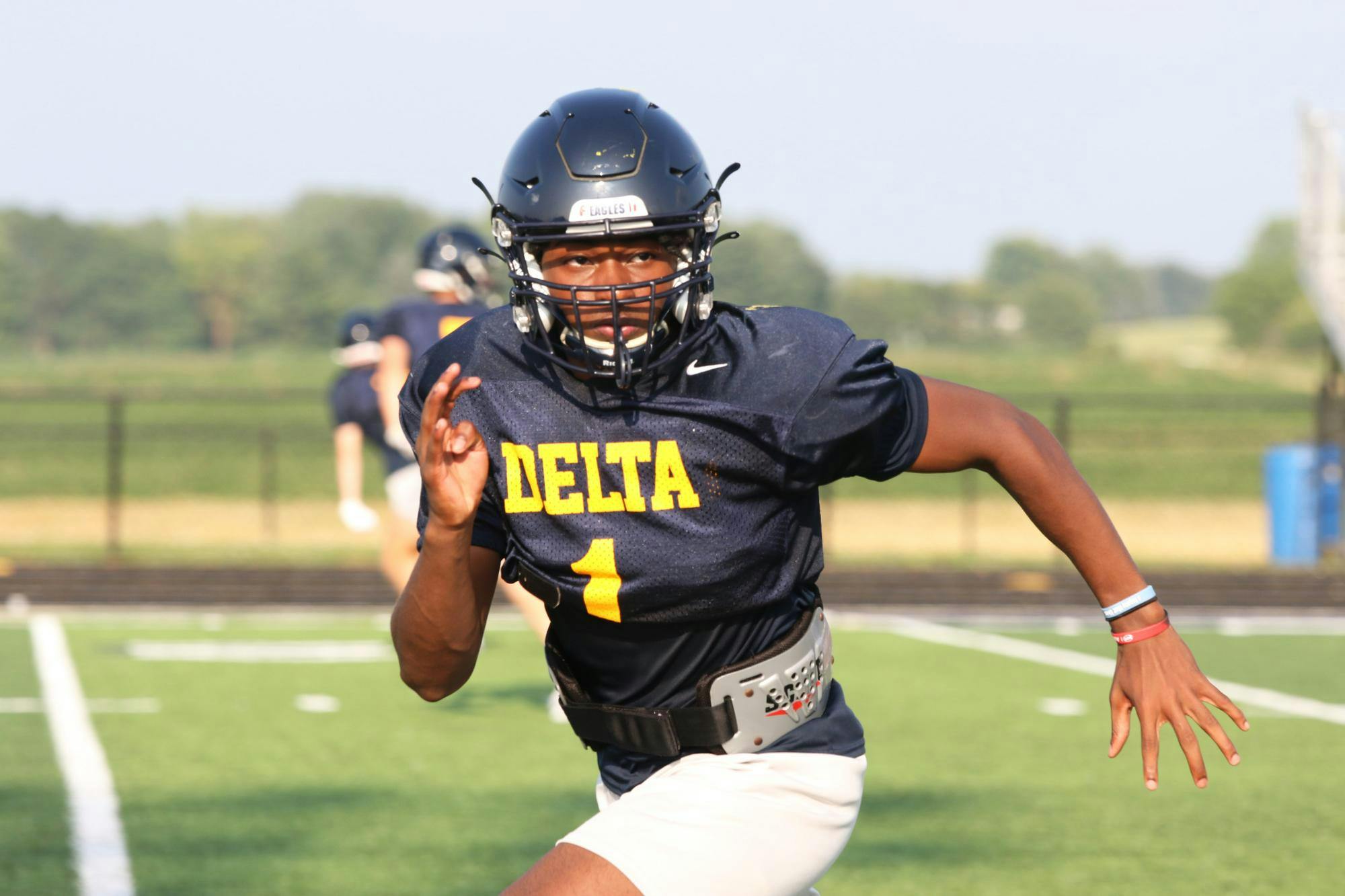Delta senior Kaiden Bond runs July 14 during a scrimmage against Jay County at Delta High School. Zach Carter, DN. 