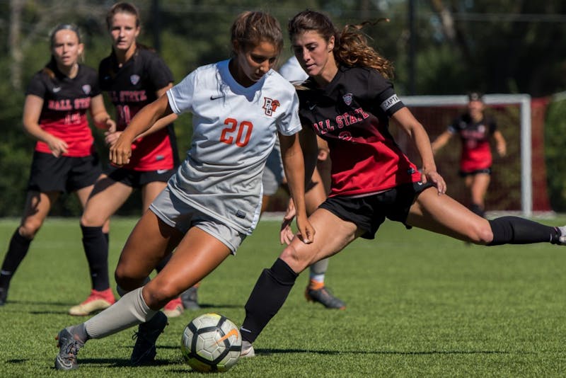 Senior midfielder Lauren Roll attempts to get the ball away from Mackenzie Ruber of Bowling Green Sept. 23, 2018, at Briner Sports Complex. Bowling Green put pressure on Ball State by scoring twice in the first half, and securing the win with a third goal during the final minutes of the game. Ball State lost 3-0. Eric Pritchett,DN