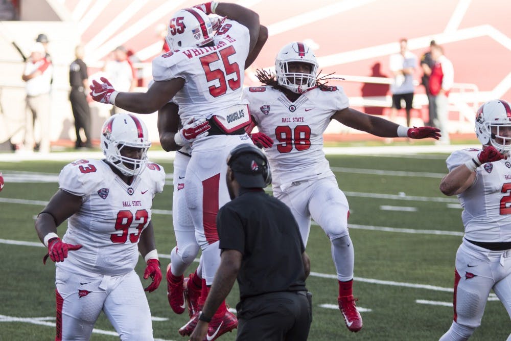Ball State defensive tackle, John Whitman III and defensive end, Sean Hammonds Jr. celebrate a fumble recovery against Indiana University at the Memorial Stadium in Bloomington, IN on Saturday, September 10. (Grace Hollars, Daily News)