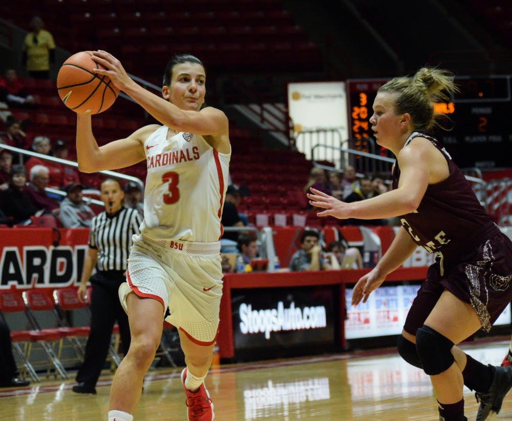 Junior guard Carmen Grande passes the ball to a teammate at the game on Monday, Nov. 13 against Missouri State in John E. Worthen Arena. Grande came from her hometown of Madrid, Spain to play at Ball State. Andrea Cooper, DN