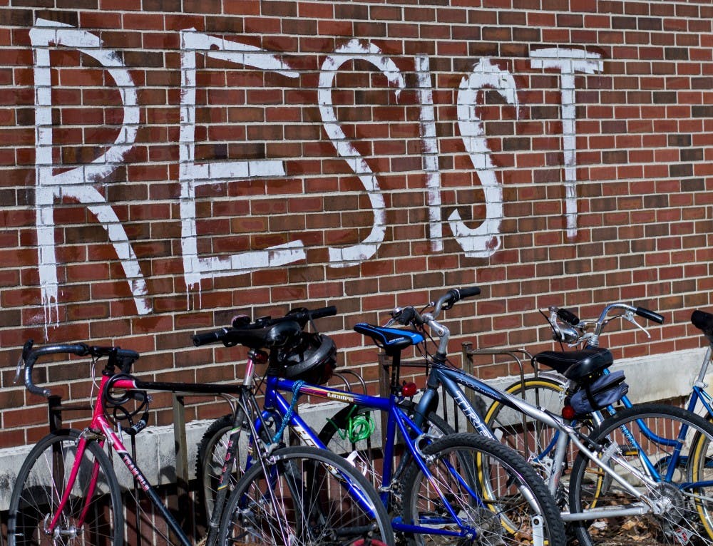 Students woke up on Feb. 24 to find "resist" signs on the College of Architecture Building, Atrium, Cooper Science Building and University Green. It's not currently known who was responsible for the signs. Teri Lightning Jr., DN