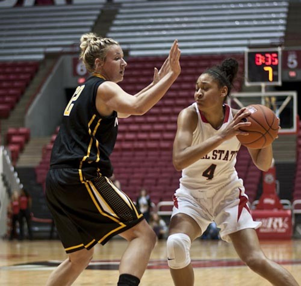 Freshman guard Nathalie Fontaine looks for an opening as Northern Kentucky’s Kelsey Simpson attempts to block. Fontaine came in second for team scoring with 15 after senior guard Shanee' Jackson's 18 points. DN PHOTO JONATHAN MIKSANEK