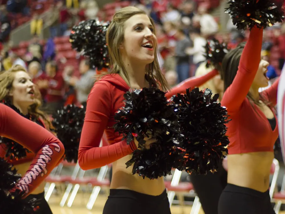 A Ball State Code Red dancer cheers during men's basketball game against Western Michigan during the second half Feb. 26 at Worthen Arena. Ball State lost in overtime 81-88. DN PHOTO AUDREY ADDINGTON
