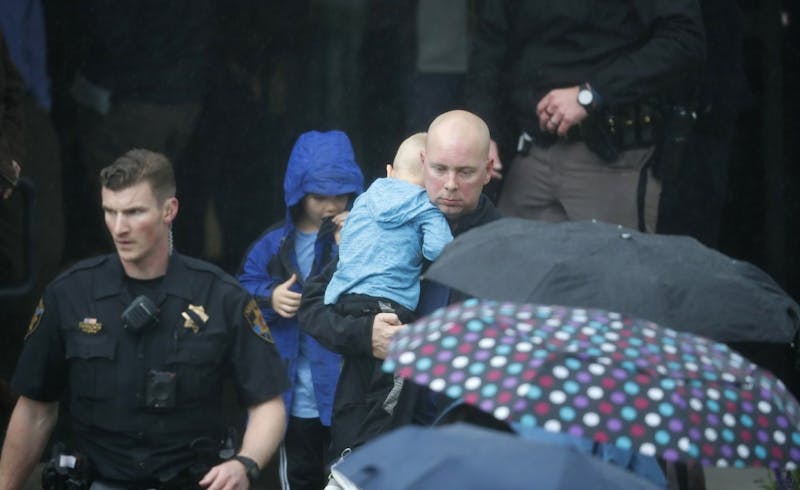 A parent leaves the recreation center where students were reunited with their parents after a shooting at a suburban Denver middle school Tuesday, May 7, 2019, in Highlands Ranch, Colo. (AP Photo/David Zalubowski)