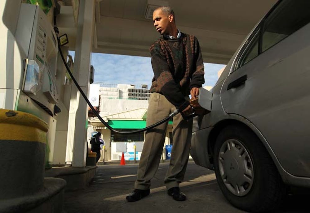 Mark Davis fills his car with gas at a BP station in Chicago, Illinois, on Monday, March 5, 2012. (Scott Strazzante/Chicago Tribune/MCT)