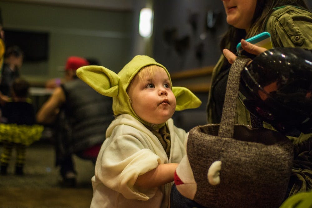 Children filled the residence halls on Oct. 27 during the annual Dorm Trick-or-Treating event. Students in various dorms set up activities and passed out candy. Reagan Allen // DN
