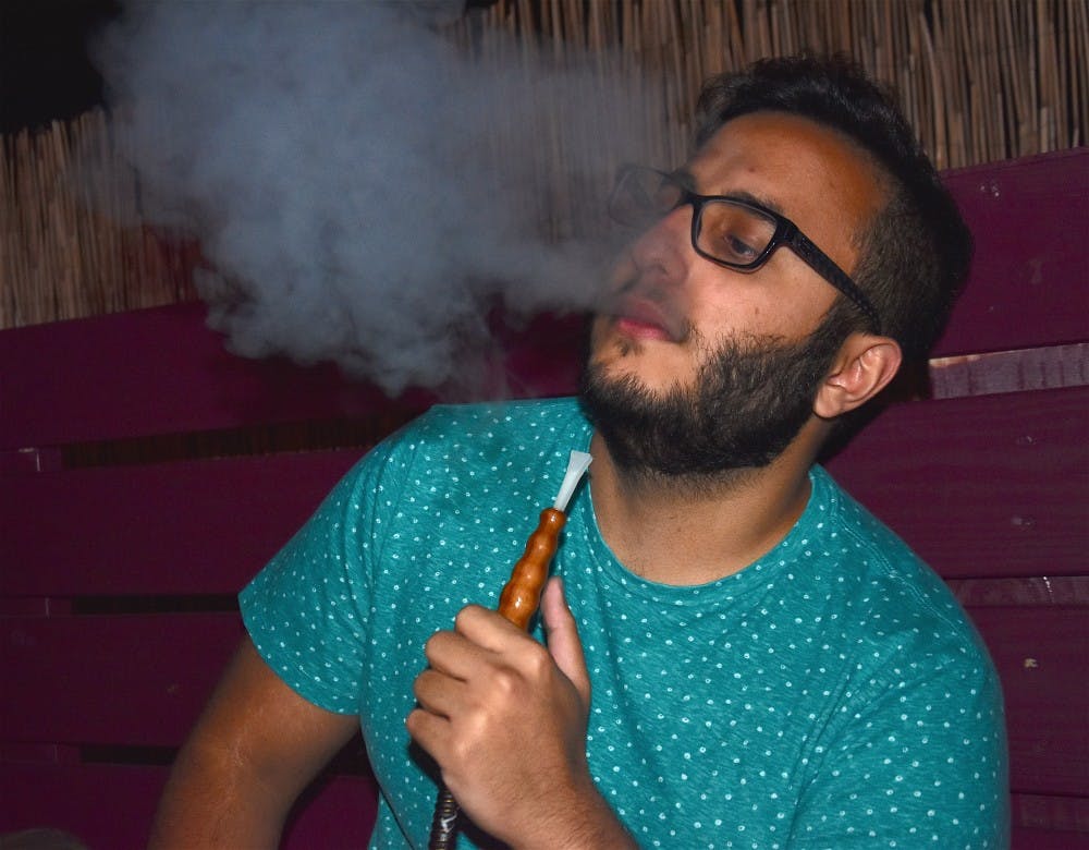 <p>Saad AbuBakr, a senior computer science major who is from the Middle East, uses hookah as a way to socialize. <em>Photo Provided</em></p>