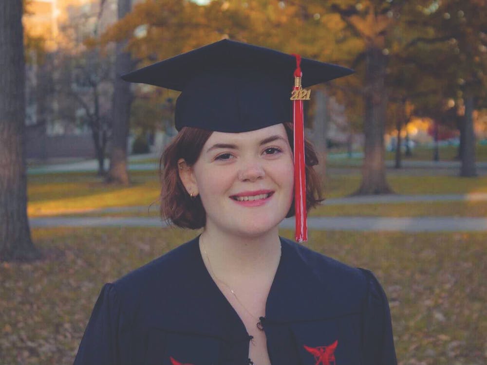 Lauren Kamykowski, senior political science and French double major, smiles for a graduation photo on Ball State&#x27;s campus. Kamykowski is a first-generation student who is graduating in three and a half years with two bachelor&#x27;s degrees. Lauren Kamykowski, Photo Provided