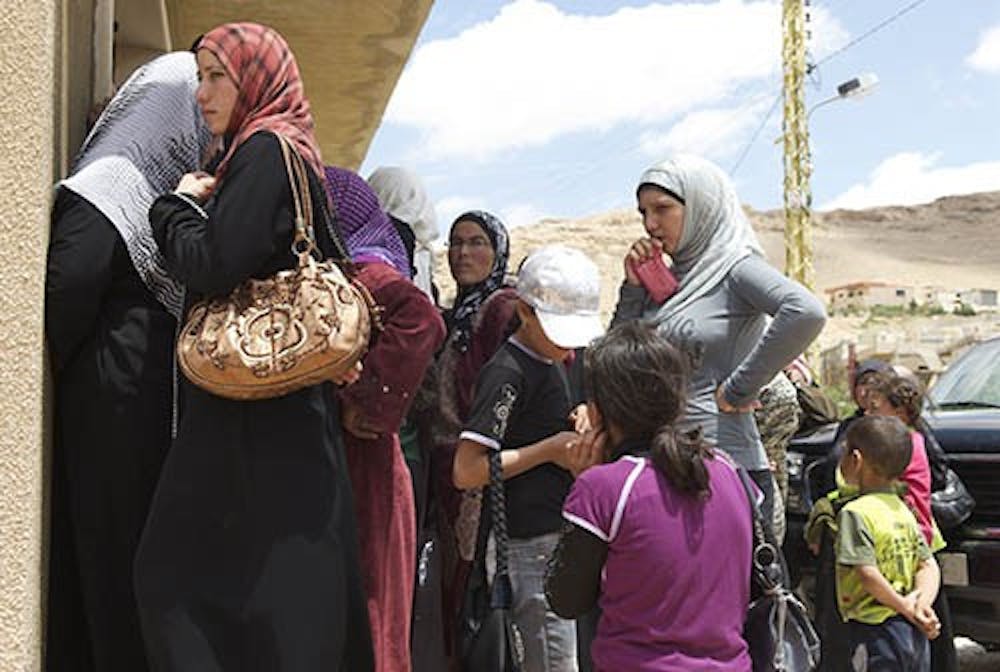 Syrian refugees wait to register for aid in Aarsal, a city in northern Lebanon. Syria has been at the center of a civil war that has forced the U.S. to consider instating a no-fly zone over the country. MCT PHOTO