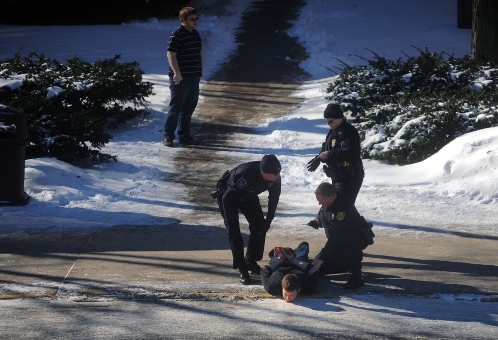 	Cody Cousins is handcuffed outside of Purdue’s Electrical Engineering Building shortly after a shooting Jan. 21. PHOTO PROVIDED BY THE PURDUE EXPONENT