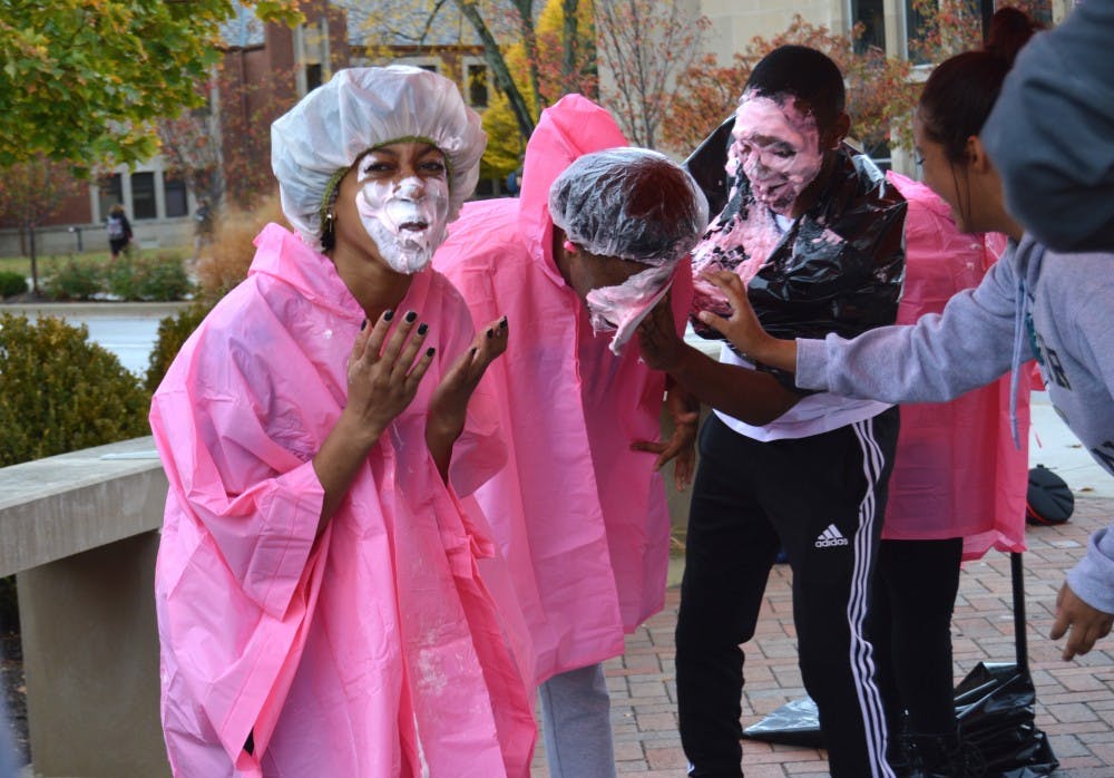 <p>The Black Student Association executive board get pied in the face to raise money for cancer on Oct. 28. The group raised an unofficial total of more than $75. <em>DN PHOTO ALLIE KIRKMAN</em></p>