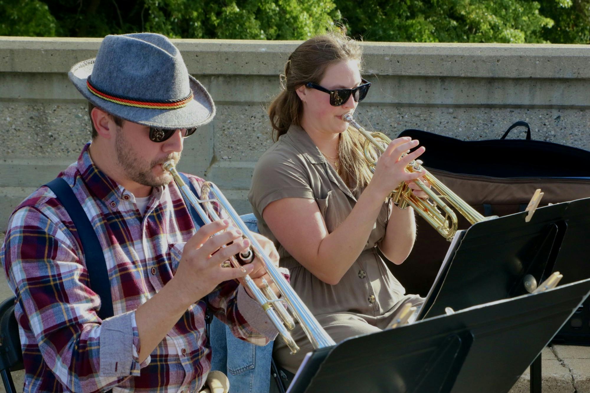Live music fills the air, entertaining onlookers while they wander what the bridge has to offer during the event in downtown Muncie Thursday, Sept. 22, 2022. Zach Gonzalez, DN