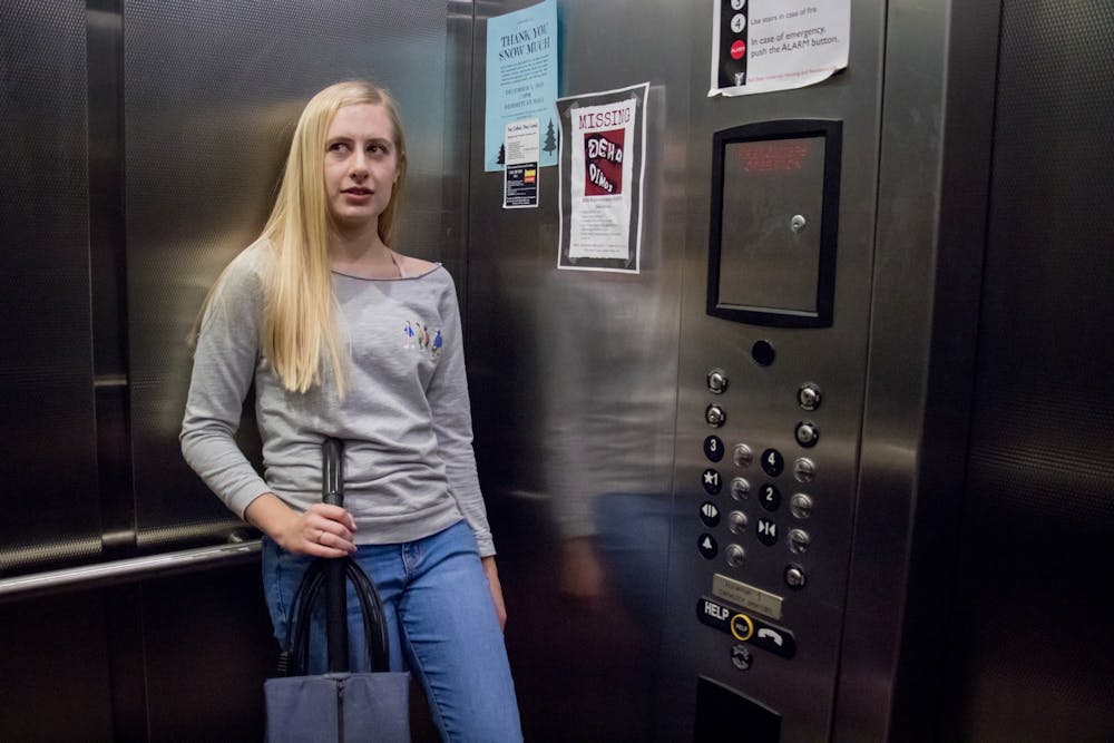 <p>Chloe Fellwock takes a vacuum up to her dorm Nov. 25, 2019, in DeHorty Complex. Fellwock does not enjoy filler talk like the question "what are you going to do with the vacuum?" when a vacuum has one primary purpose. <strong>Eric Pritchett, DN</strong></p>