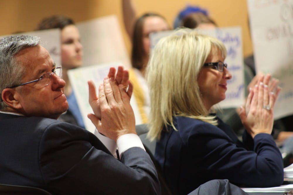 <p>Board of Trustees member Brian Gallagher and Vice President for Marketing and Communications Kathy Wolf clap to a presentation Feb. 3, 2017. Gallagher resigned from his position as CEO of United Way Worldwide Feb. 9, 2021. <strong>Patrick Murphy, DN File</strong></p>