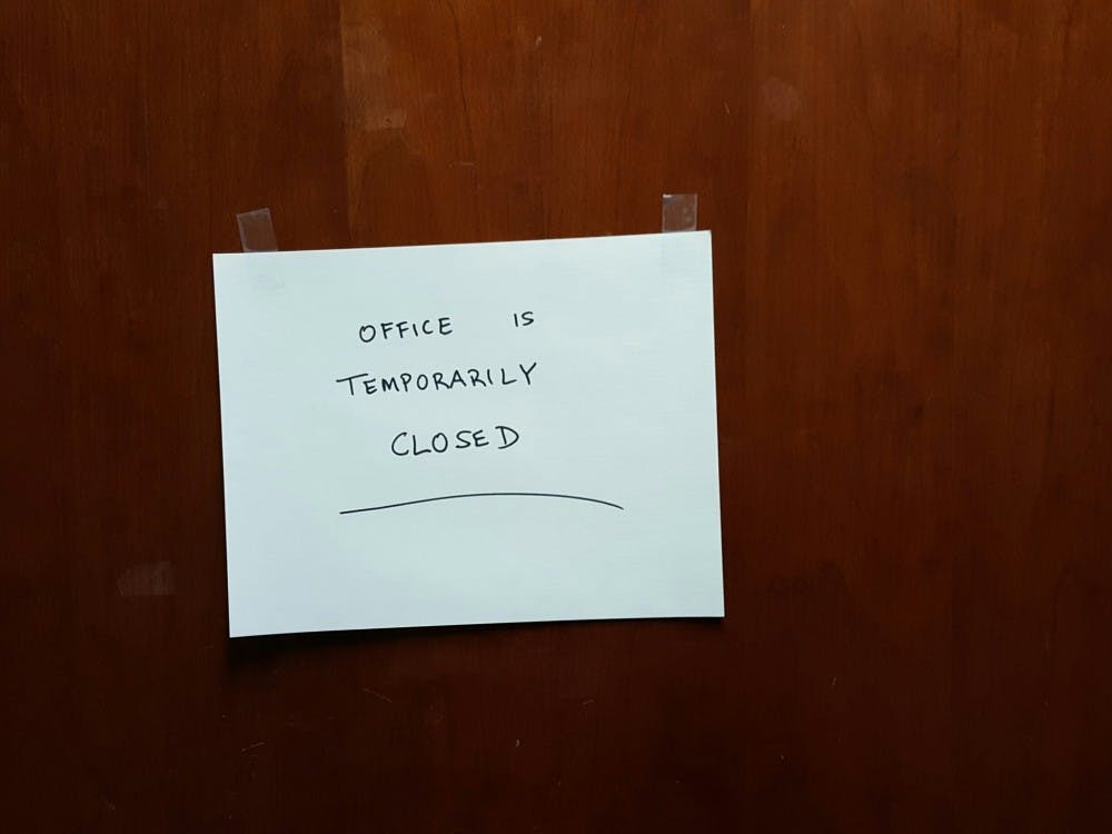 <p>A paper sign outside of the building commissioner's office at Muncie City Hall on Jan. 5. The FBI conducted a search warrant, closing the office for the remainder of the day. <em>Tony Sandleben // Provided<br></em></p>