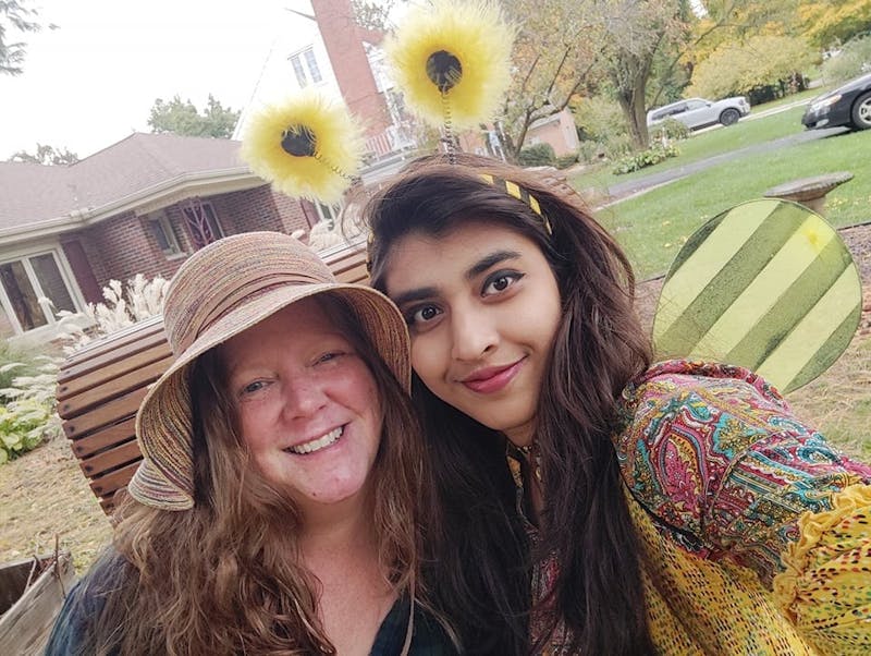 Lilunnaher Chandni poses with her Friendship Family host Amy Beckett, Ball State assistant teaching professor of criminal justice and criminology. The pair dressed as a farmer and bee for Halloween. Amy Beckett, Photo Provided