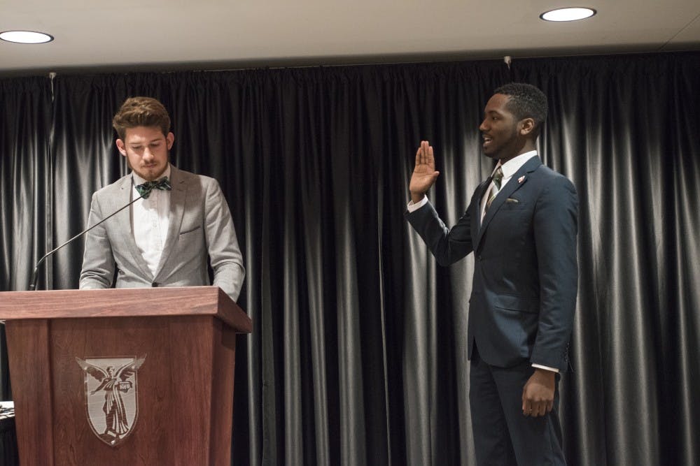 Outcoming President Jack Hesser swears in James Wells to be the next president on April 20 at the L.A. Pittenger Student Center Cardinal Hall C. DN PHOTO STEPHANIE AMADOR. 