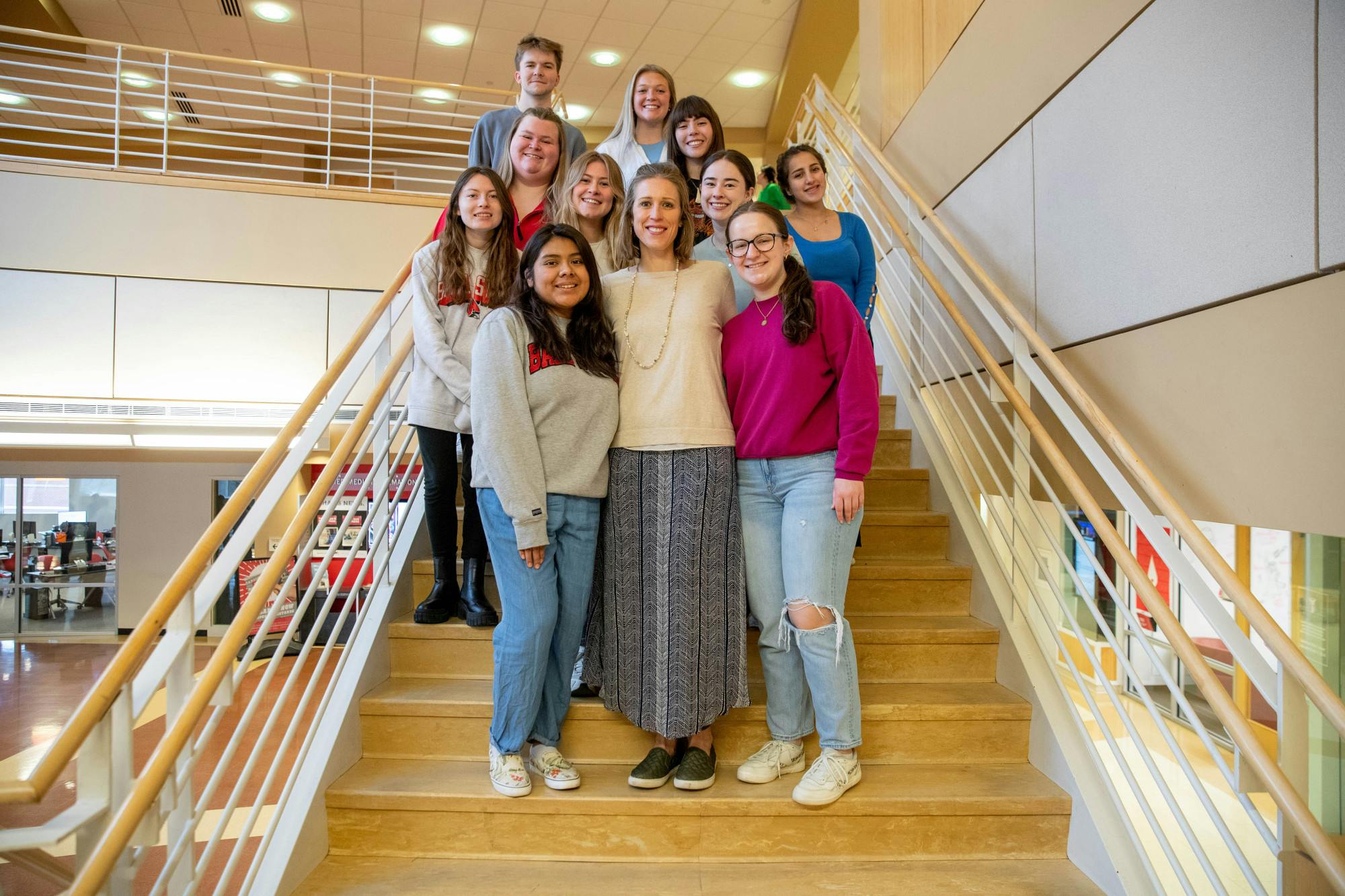 Kate Elliott, assistant lecturer of journalism, with students in the fall 2023 Inform Muncie class. 
