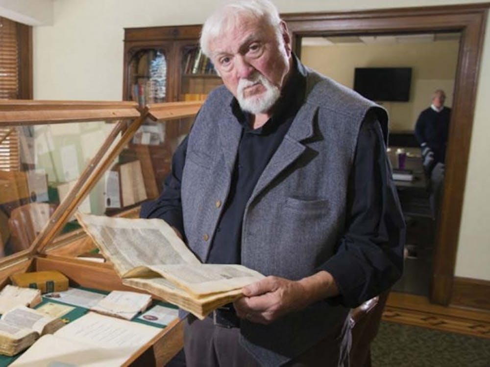 Brian Bex reads through one of the rare books in the collection he started in 1997. Currently, he has collected more than 1,300 books that students and professors at different universities can browse and use for information. E. B. and Bertha C. Ball Center, photo courtesy. 