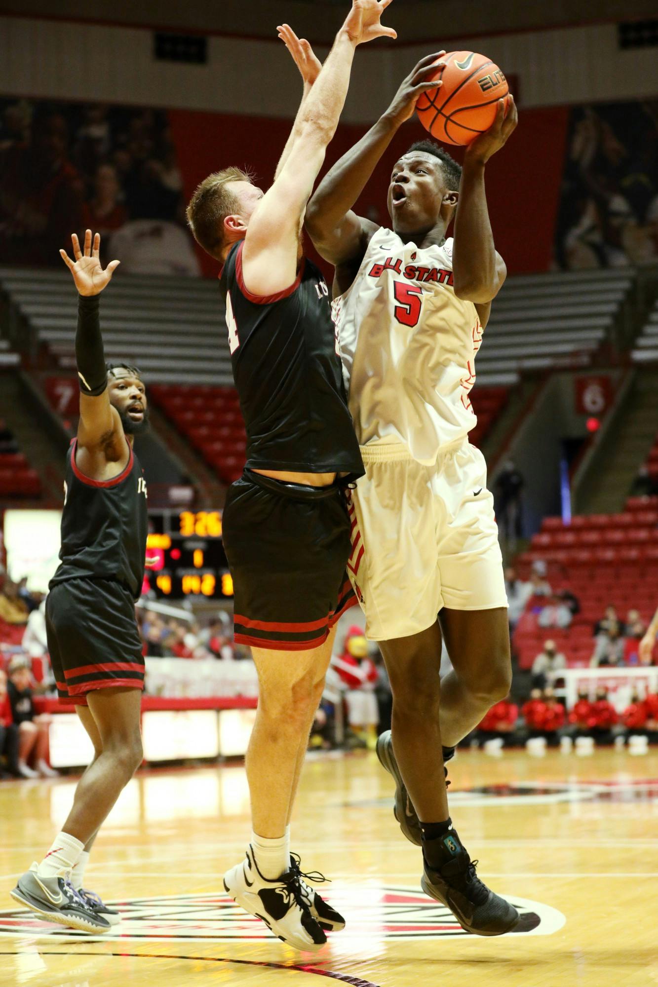 Freshman center Payton Sparks (5) attempts to shoot the ball against IU Kokomo on Dec. 12, 2021 at Worthen Arena in Muncie, IN. Sparks scored 12 points throughout the game. Amber Pietz, DN
