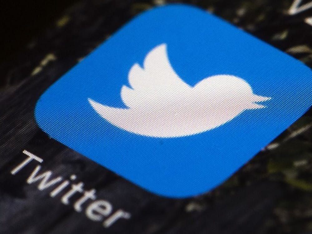 FILE - This April 26, 2017, file photo shows the Twitter app icon on a mobile phone in Philadelphia. Twitter is enlisting its users to help combat misinformation on its service by flagging and notating misleading and false tweets. (AP Photo/Matt Rourke, File)