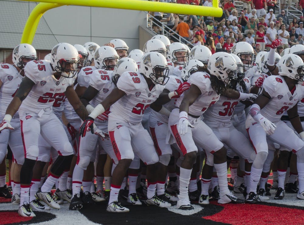 The Ball State football team prepares to run out onto the field before the game against Virginia Military Institute on Sept. 3 at Scheumann Stadium. DN PHOTO BREANNA DAUGHERTY