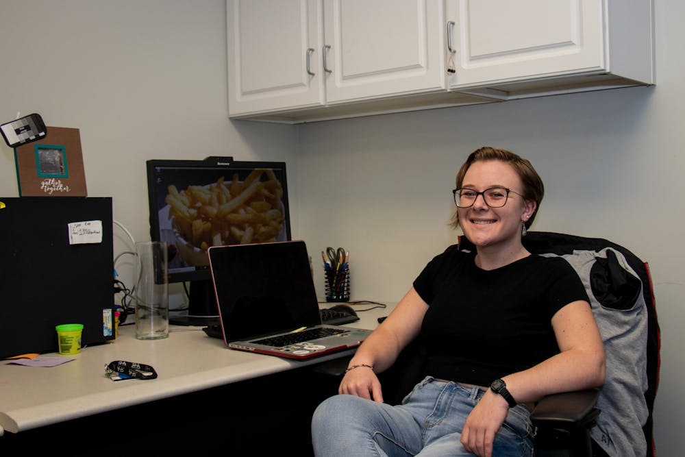 <p>Senior Jackie Weisenfelder sits at a desk in the Residence Hall Association's (RHA) office. Weisenfelder joined the RHA's executive board as a sophomore and has since become the organization's president. <strong>Eric Pritchett, DN</strong></p>