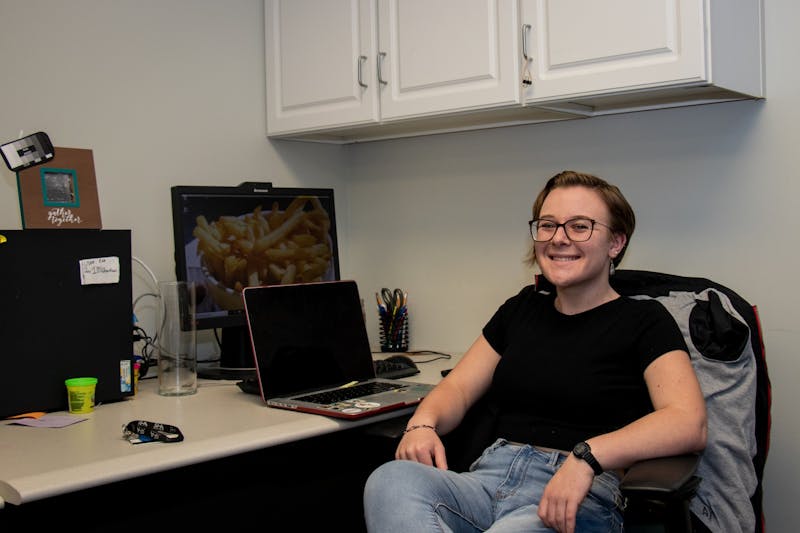 Senior Jackie Weisenfelder sits at a desk in the Residence Hall Association's (RHA) office. Weisenfelder joined the RHA's executive board as a sophomore and has since become the organization's president. Eric Pritchett, DN