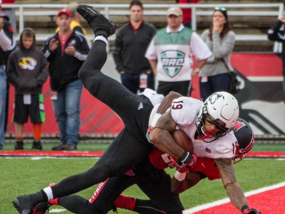 Northern Illinois senior wide receiver Kenny Golladay is tackled into the end zone in the Huskies' 31-24 win over Ball State at Scheumann Stadium on Oct. 1. Golladay caught 13 passes for 184 yards and two touchdowns in the game. Grace Ramey // DN