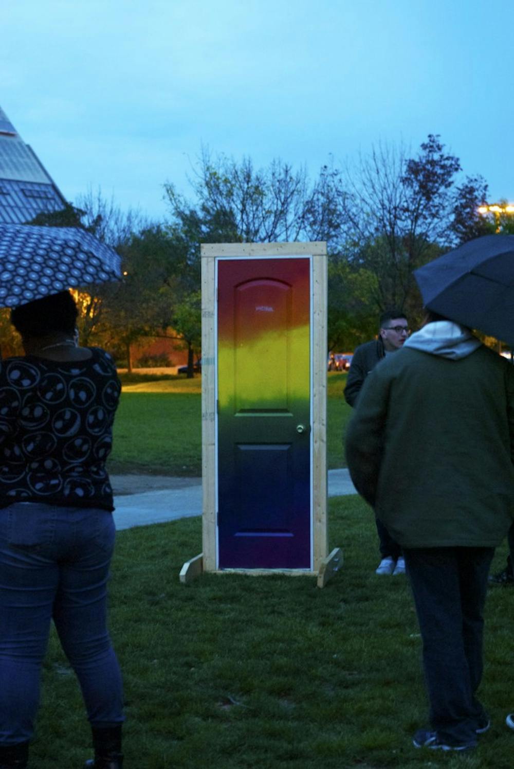 At National Coming Out Day on Oct. 10 on University Green, students would walk through the rainbow-colored door and then tell their personal stories of how they came out to their peers. DN PHOTO SAMANTHA BRAMMER