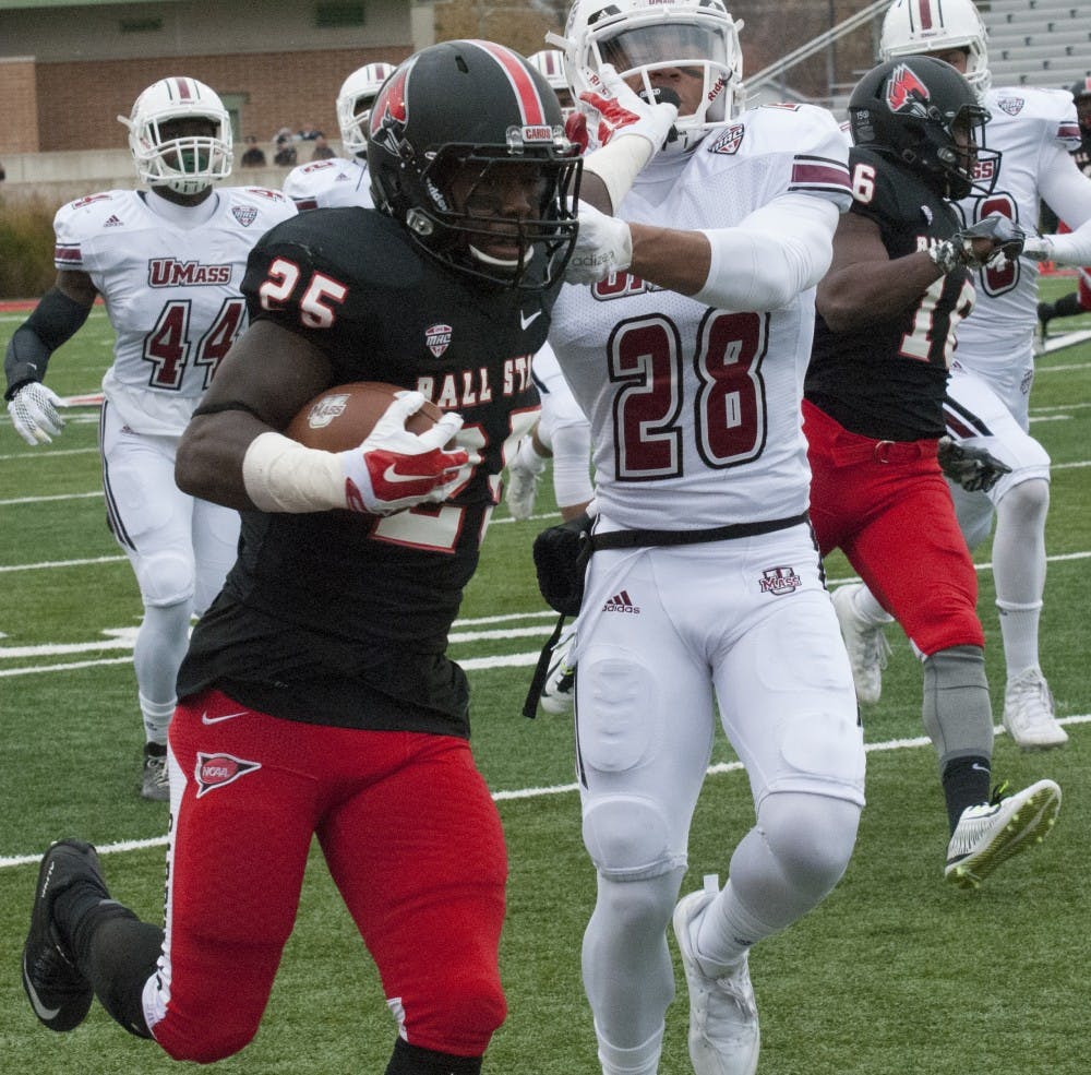 Sophomore running back Darian Green completes a pass on Saturday Oct. 31 at the Ball State vs. University of Massachusetts game. DN PHOTO ALLISON COFFIN