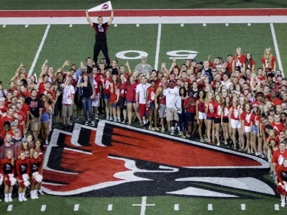 Students gather around the cardinal as a part of Student Government's 'Cardinal Project' after the football game against Virginia Military Institute on Sept. 3 at Schuemann Stadium DN PHOTO MAKAYLA JOHNSON