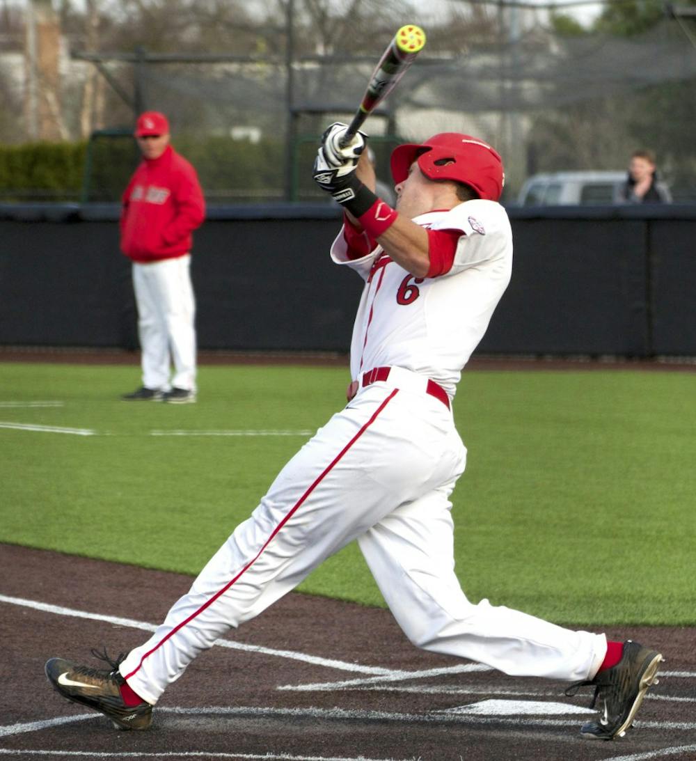 Junior infielder for the Ball State Cardinals Alex Maloney attempts to hit the ball during the game against Dayton on March 18. DN PHOTO GRACE RAMEY