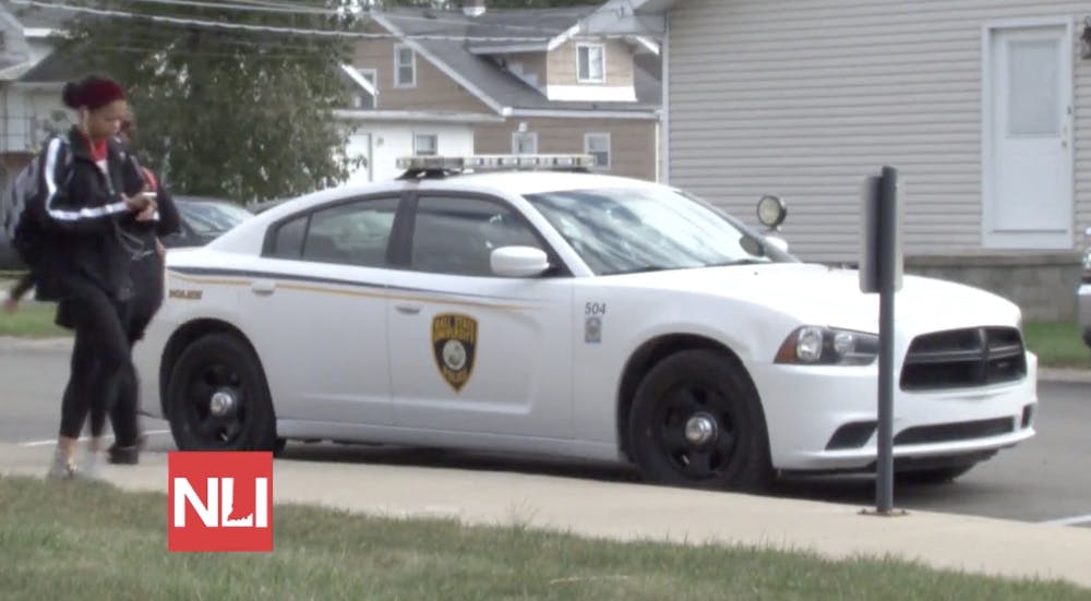 Ball State University Police(UPD) cars line the road next to the police station on Oct. 15. UPD will have a heightened presence on campus this week as homecoming festivities continue.