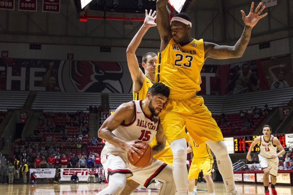 <p>Guard Franko House pushes his way for a two-point lay up against Toledo forward Steve Taylor Jr. on Jan. 31 in Worthen Arena. Ball State defeated Toledo 81-80. Grace Hollars // DN File</p>