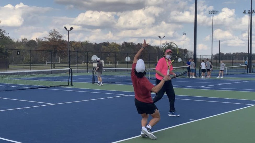 Senior Brandon Jackson serving the ball at practice.