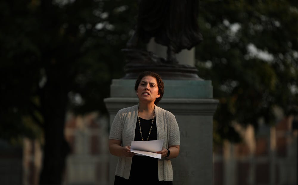 <p>Provost and Executive Vice President for Academic Affairs Susana Rivera-Mills speaks at the feet of Beneficence during the 9/11 memorial ceremony, Sept. 10, 2021. Rivera-Mills has been Provost since July 2018. <strong>Rylan Capper, DN</strong></p>