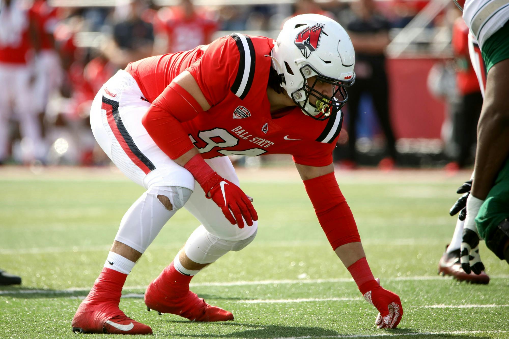 Redshirt junior defensive lineman Jack Sape prepares for the ball to be snapped in Ball State's homecoming game against Eastern Michigan Oct. 22 at Scheumann Stadium. Sape had two total photos during the game. Amber Pietz, DN