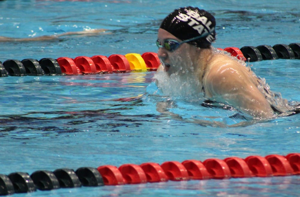 Freshman Cailin Merck competes in the 100-yard breaststroke during the tri-meet at IUPUI Natorium. Merck finished with a 1:09.74. Patrick Murphy, DN